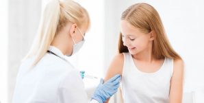 Young woman receiving vaccination.