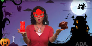 Opening screen from a video titled Dentists Confess What We Give Out for Halloween. Illustration of woman in a costume holding a gummy bear and chocolate bars.