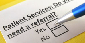 A photo illustration of a card that reads Patient Services. Do You Need a Referral? Yes? No?